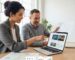 Local web designer and small business owner discussing SEO dashboard in bright studio