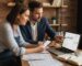 Small business owner and SEO consultant reviewing local search tools on laptop