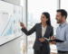 Professional consultant discussing SEO dashboard metrics with small business owner in office