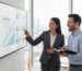 Professional consultant discussing SEO dashboard metrics with small business owner in office