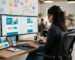 Professional web designer behind the shoulder view, working on responsive website layout in a modern office with multiple devices