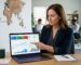 Business owner reviewing Google Business Profile engagement metrics on laptop screen with map and smartphone