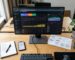 Overhead view of a modern workspace with SEO monitoring tools and a roadmap for strategic planning.